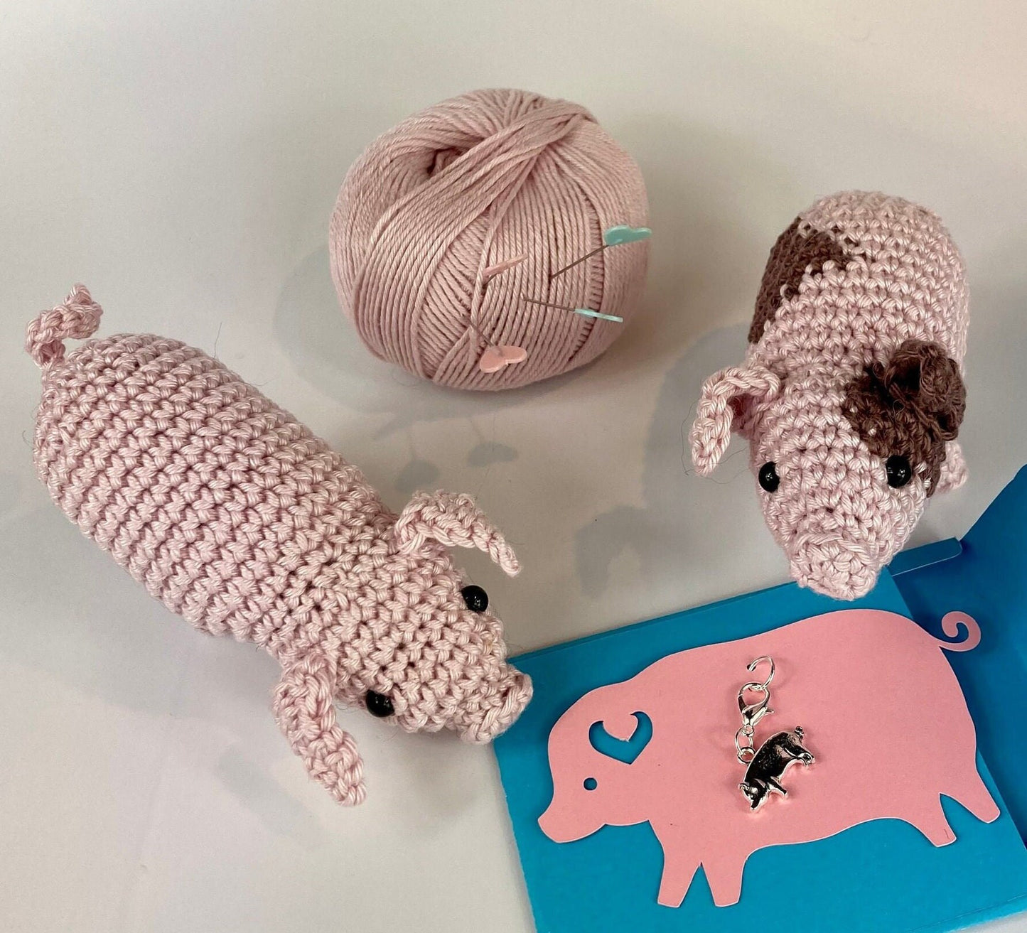 Piglets Crochet Kit. A complete kit for you to crochet a pair of the cutest piglets in luxury Natural British yarn. Mini pig stitch marker.
