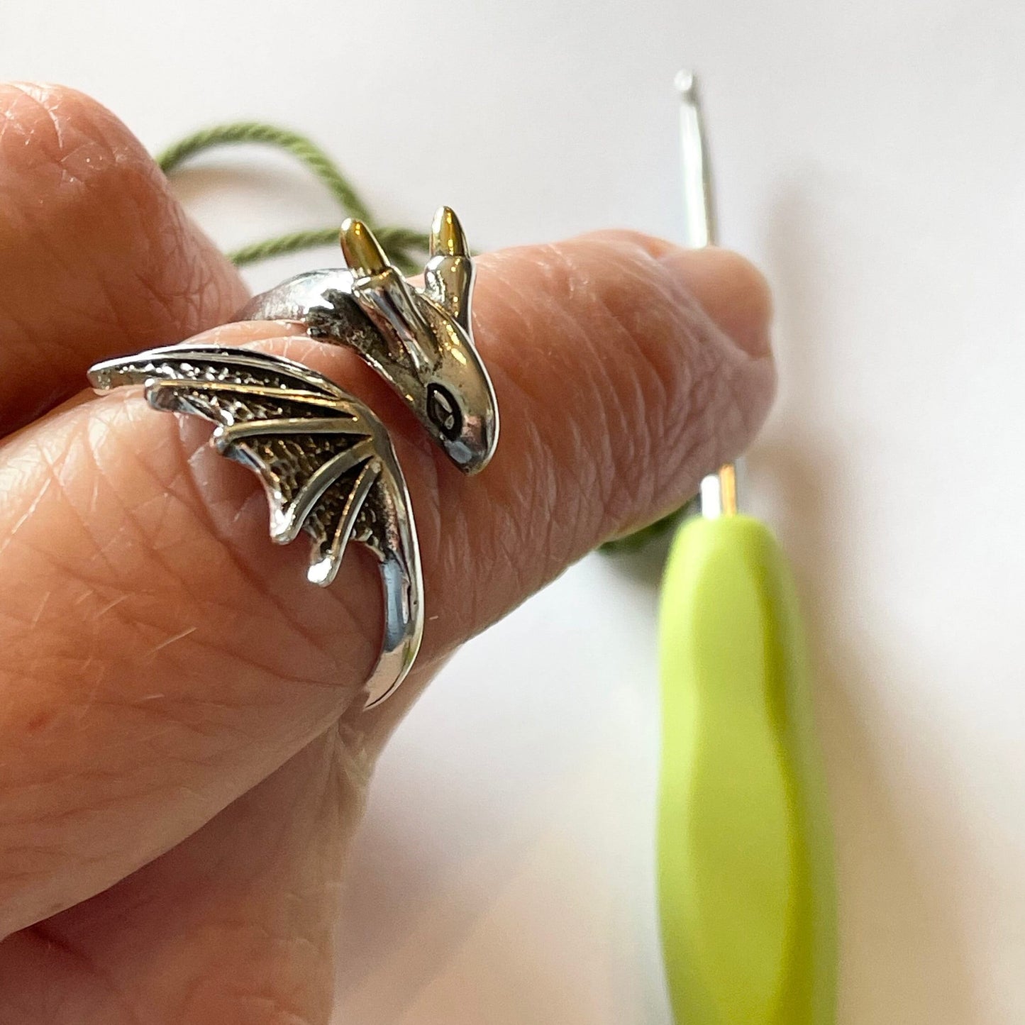 Dragon Crochet Ring in Sterling Silver. The cutest little dragon features in this silver, adjustable ring for crochet tension and comfort.
