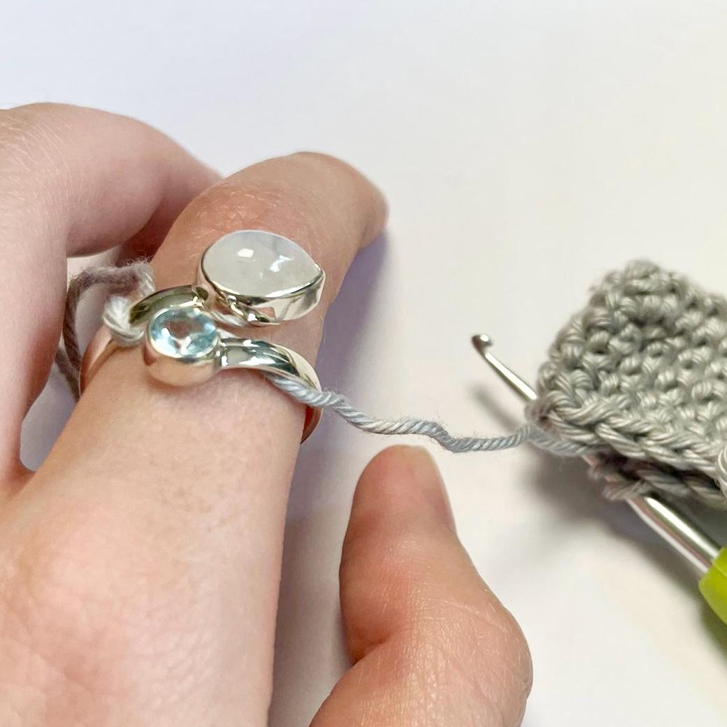 Handmade Blue Topaz and Moonstone Sterling Silver Crochet Ring. Adjustable for crochet tension and comfort. Handmade for Nautilus Crochet.