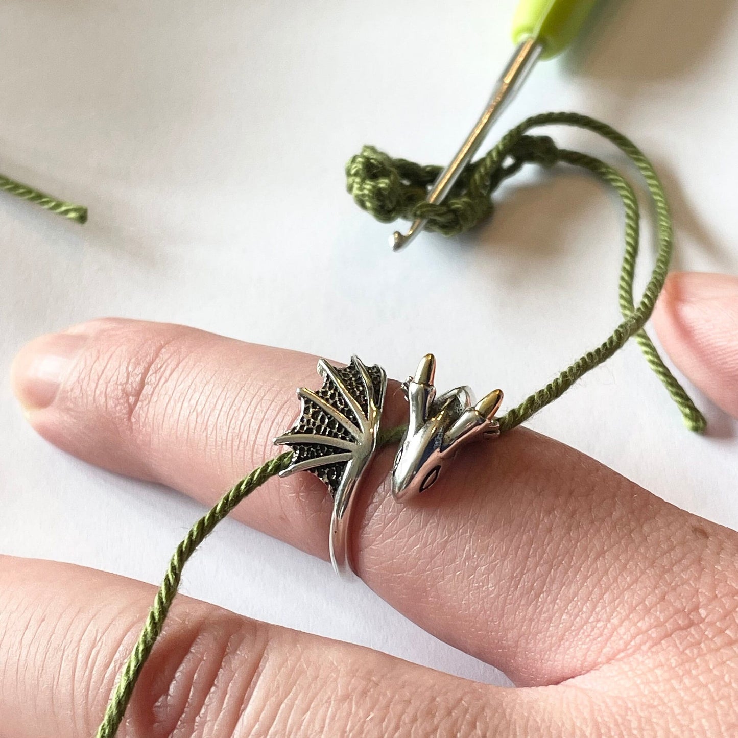Dragon Crochet Ring in Sterling Silver. The cutest little dragon features in this silver, adjustable ring for crochet tension and comfort.