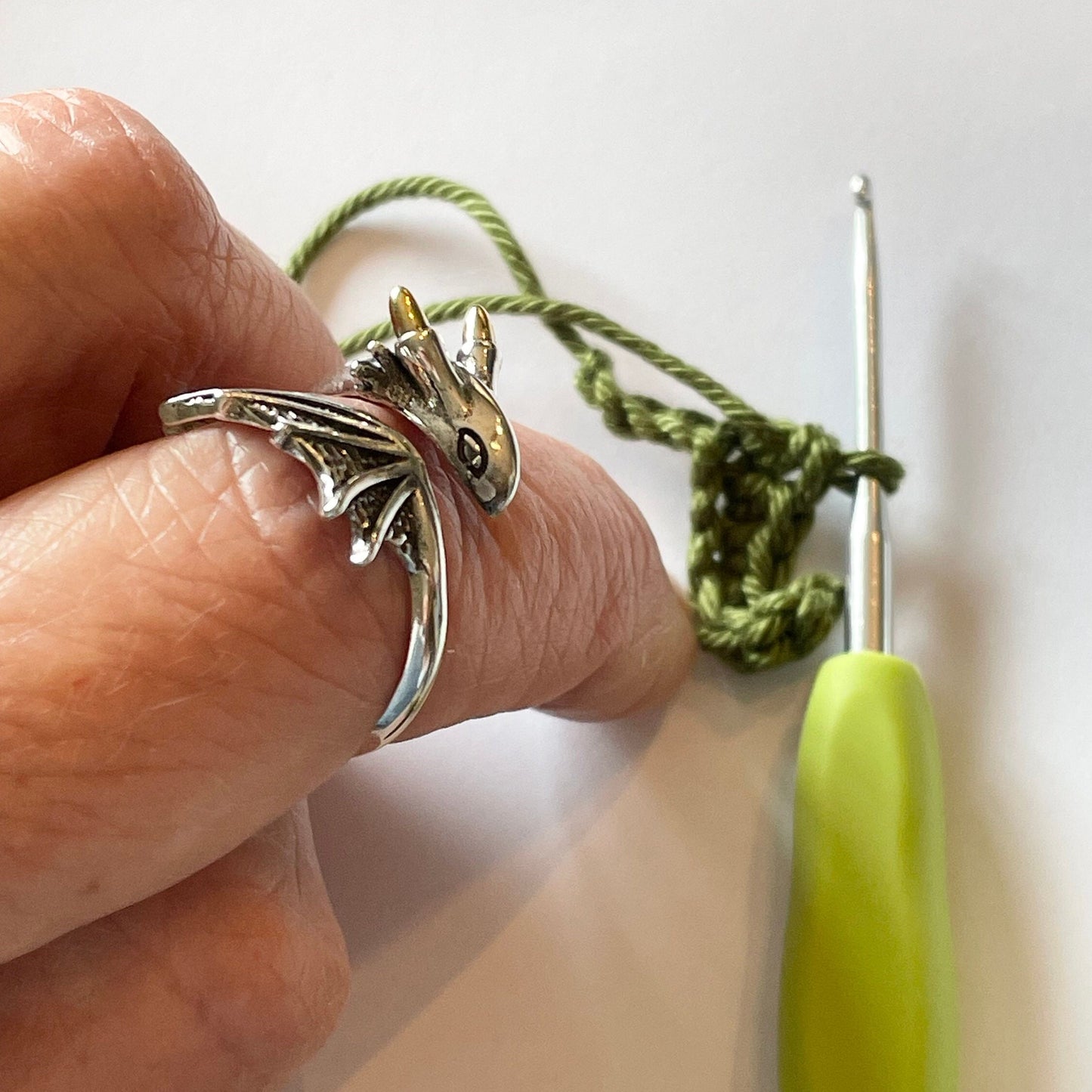 Dragon Crochet Ring in Sterling Silver. The cutest little dragon features in this silver, adjustable ring for crochet tension and comfort.