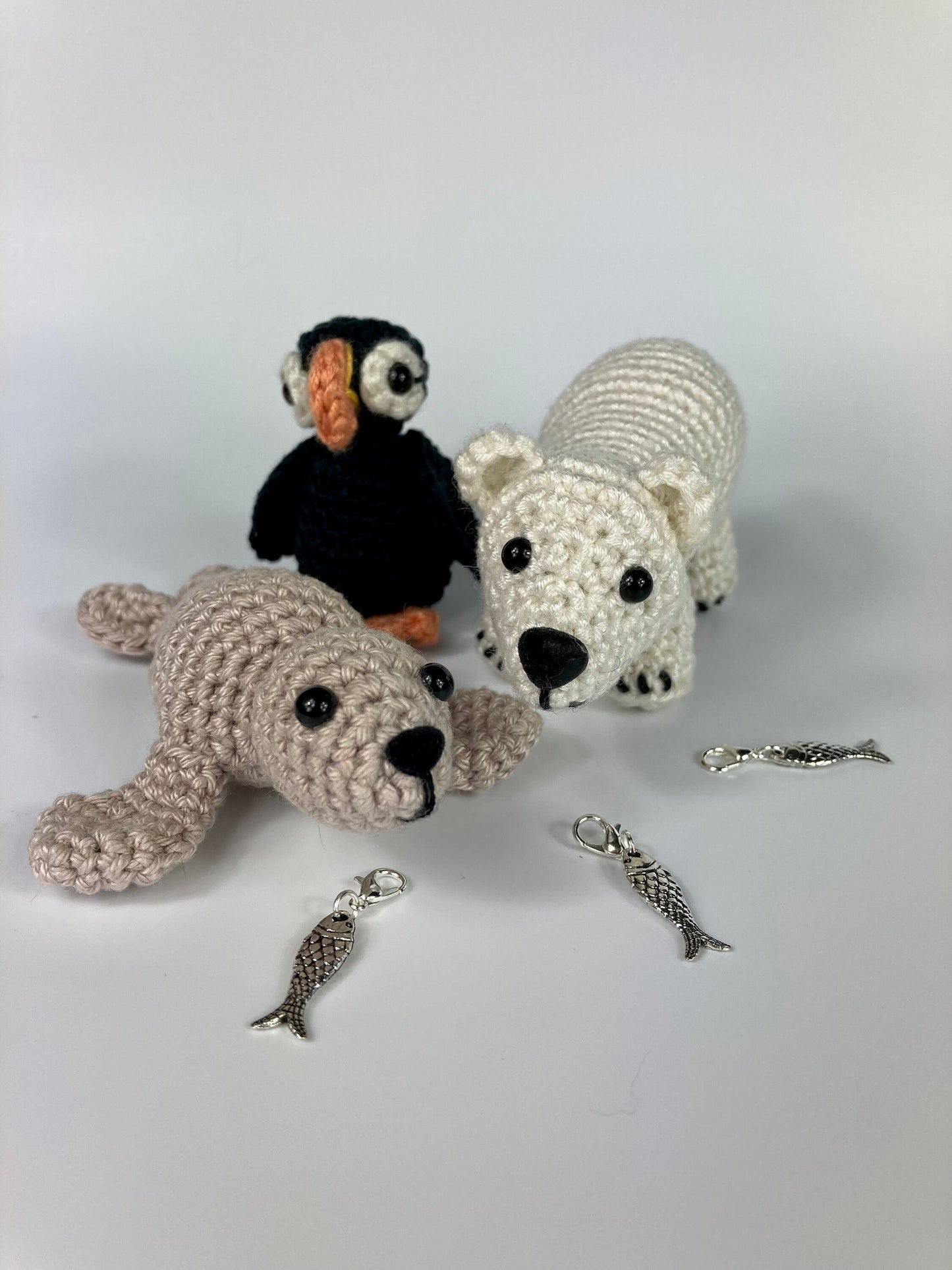 Harp Seal Kit. A full kit with luxury yarns and fittings plus a silver fish stitch-marker.
