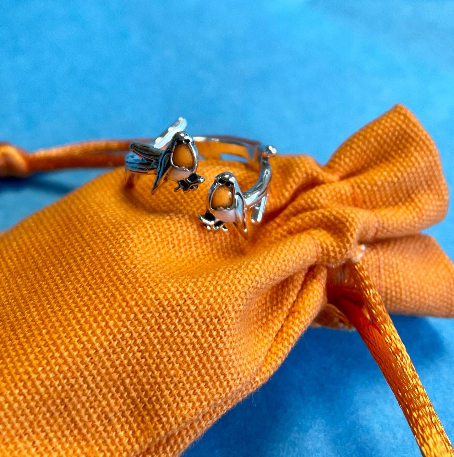 Robin Crochet Ring. This adorable ring features 2 robins perched on a gnarled branch. Silver plated & Size Adjustable. For Crochet Tension.