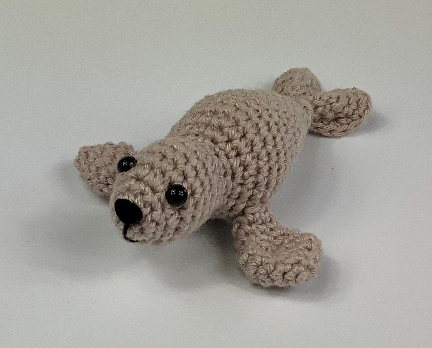 Harp Seal Kit. A full kit with luxury yarns and fittings plus a silver fish stitch-marker.