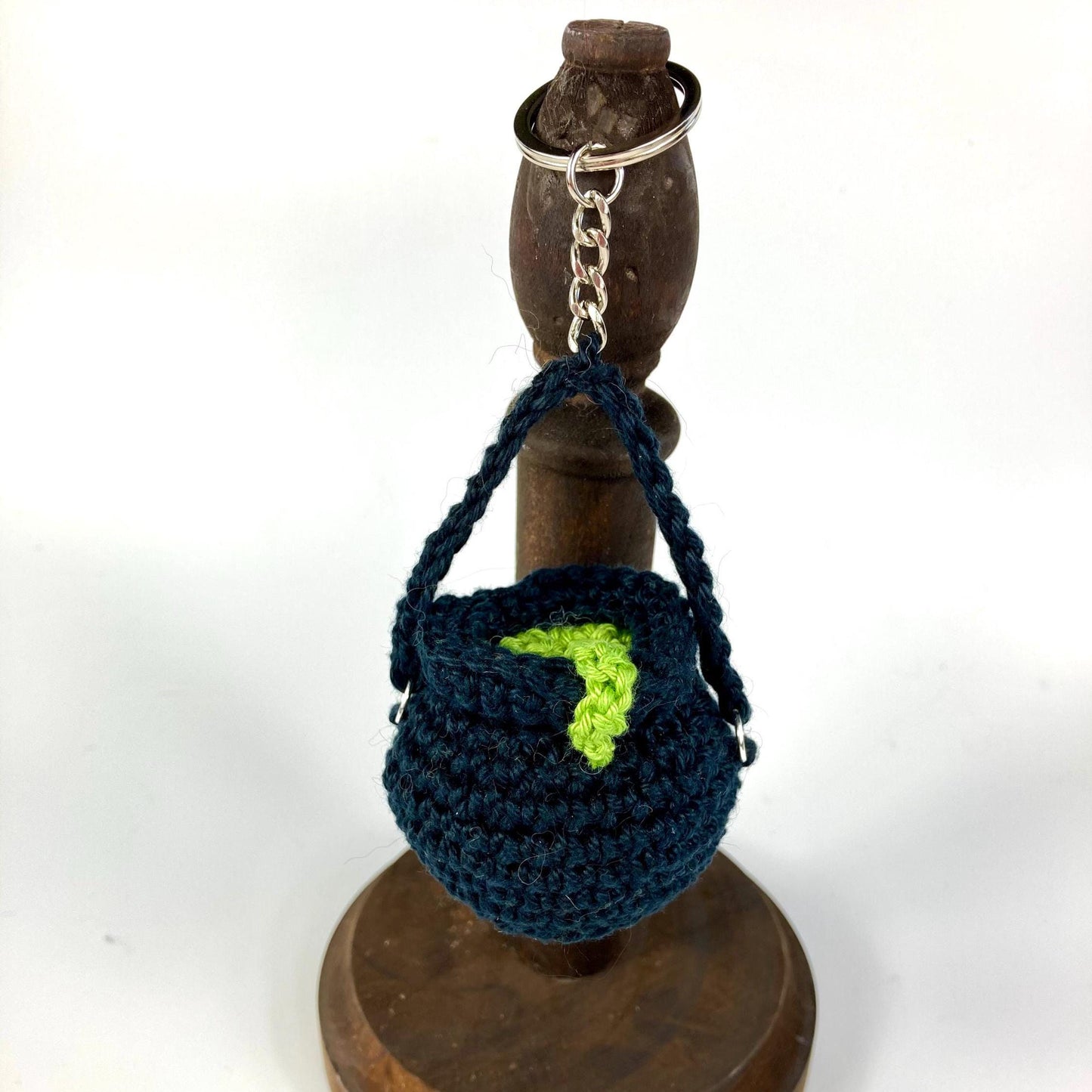 Witch’s Cauldron Keyring Crochet Kit. Including luxury yarns & a silver plated stitch marker/ keyring charm in a black velvet bag.