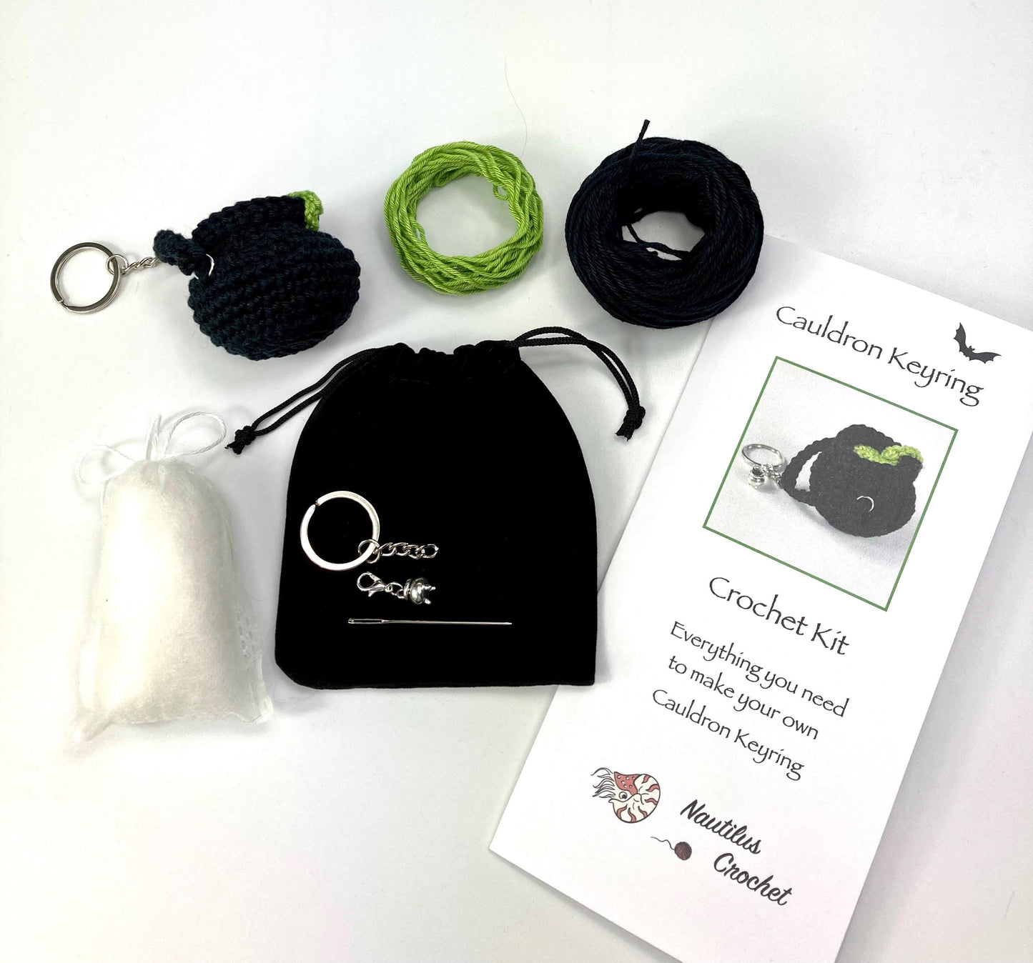 Witch’s Cauldron Keyring Crochet Kit. Including luxury yarns & a silver plated stitch marker/ keyring charm in a black velvet bag.