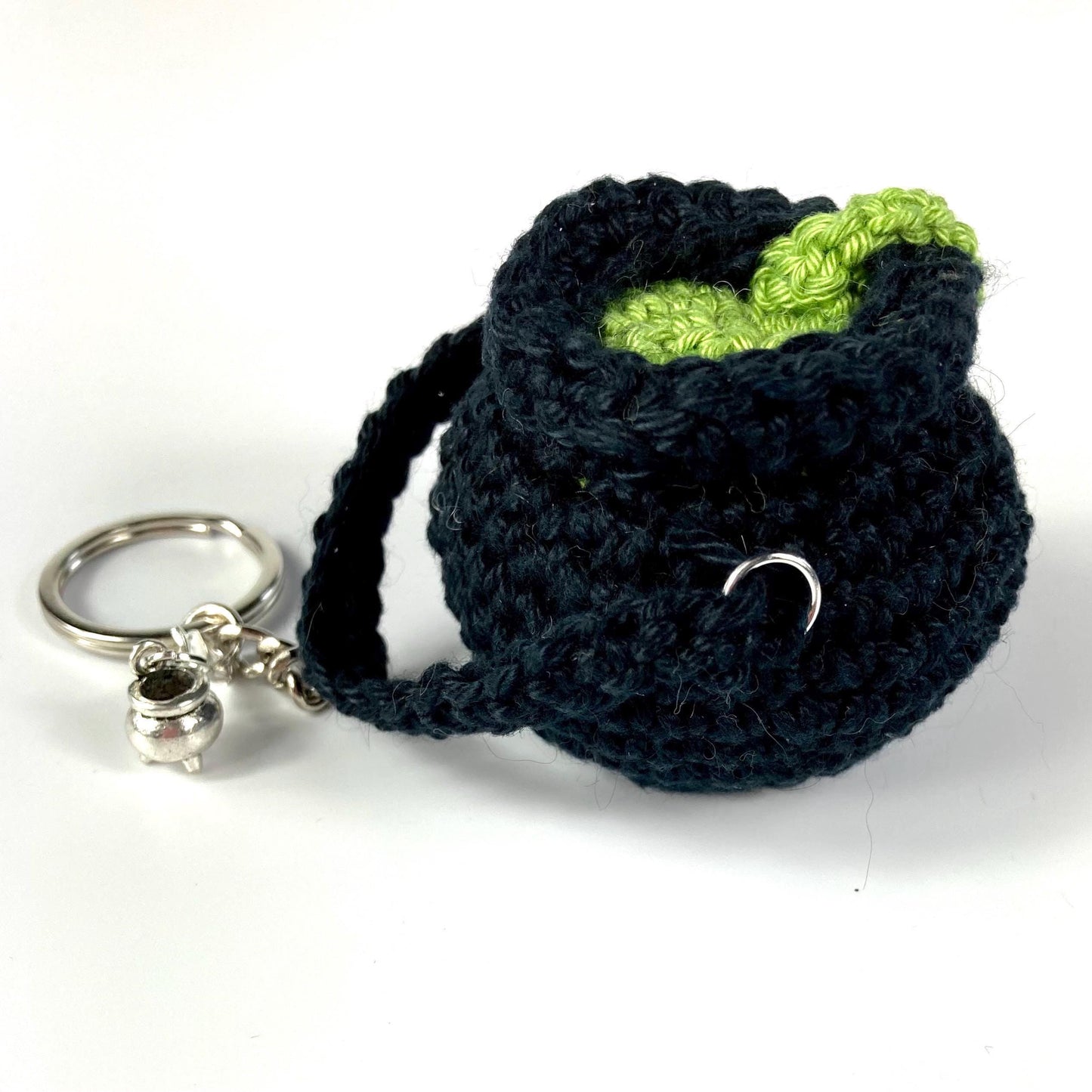 Witch’s Cauldron Keyring Crochet Kit. Including luxury yarns & a silver plated stitch marker/ keyring charm in a black velvet bag.