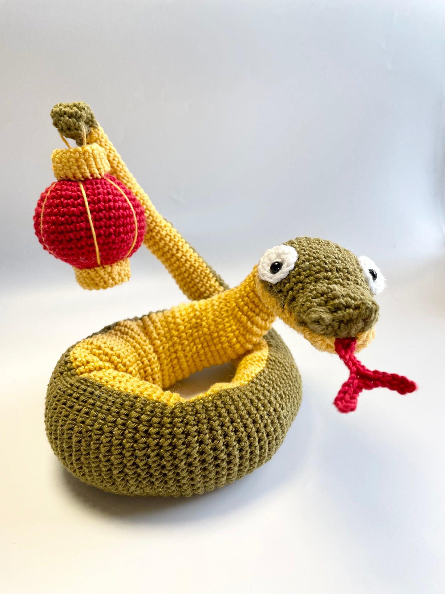 Lunar New Year Snake & Lantern Crochet Kit. Complete kit with full instructions, crochet hook and luxury yarns.