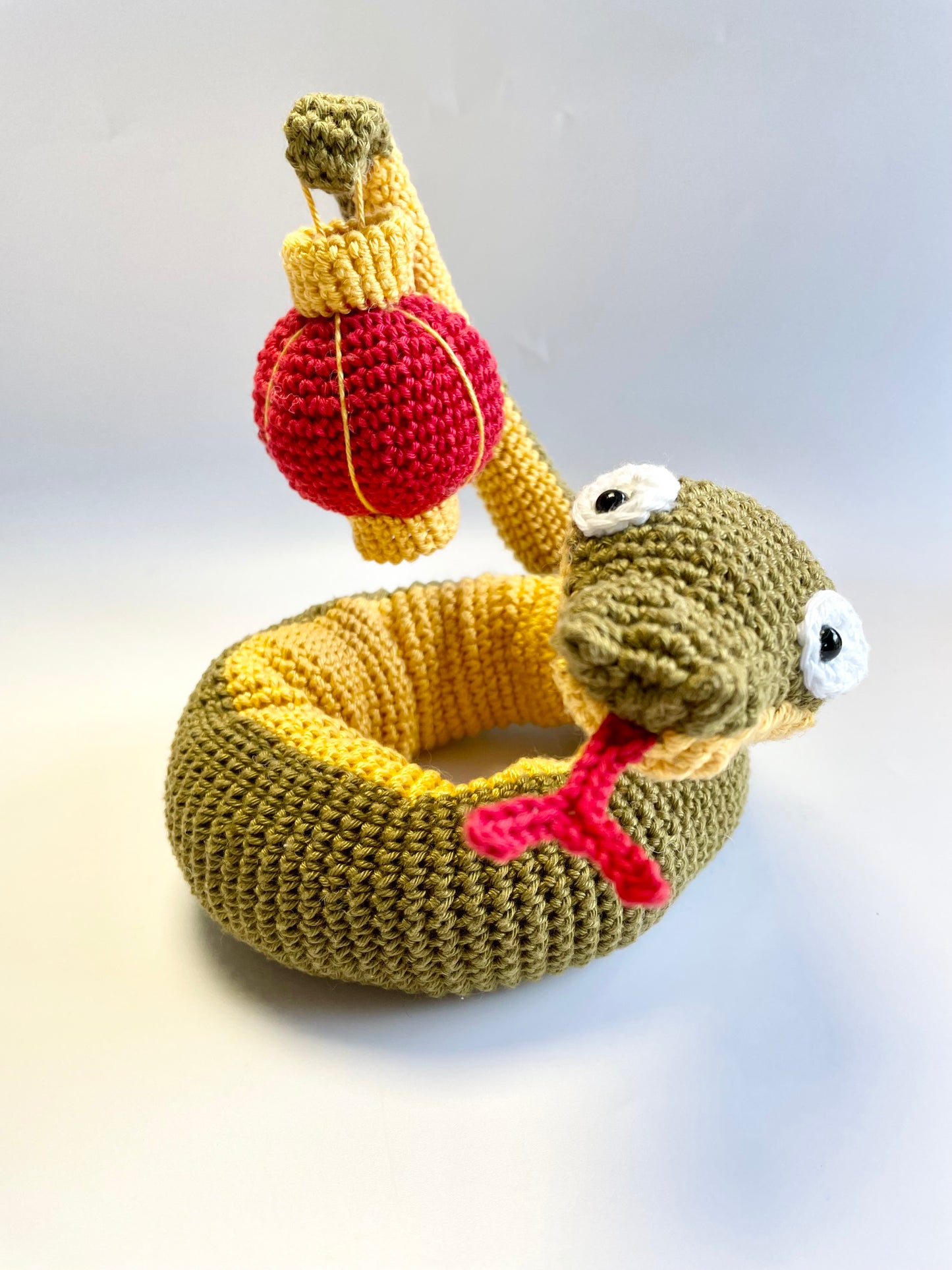 Lunar New Year Snake & Lantern Crochet Kit. Complete kit with full instructions, crochet hook and luxury yarns.