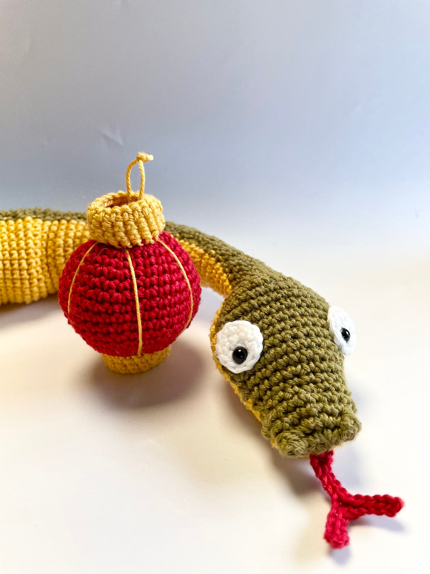 Lunar New Year Snake & Lantern Crochet Kit. Complete kit with full instructions, crochet hook and luxury yarns.