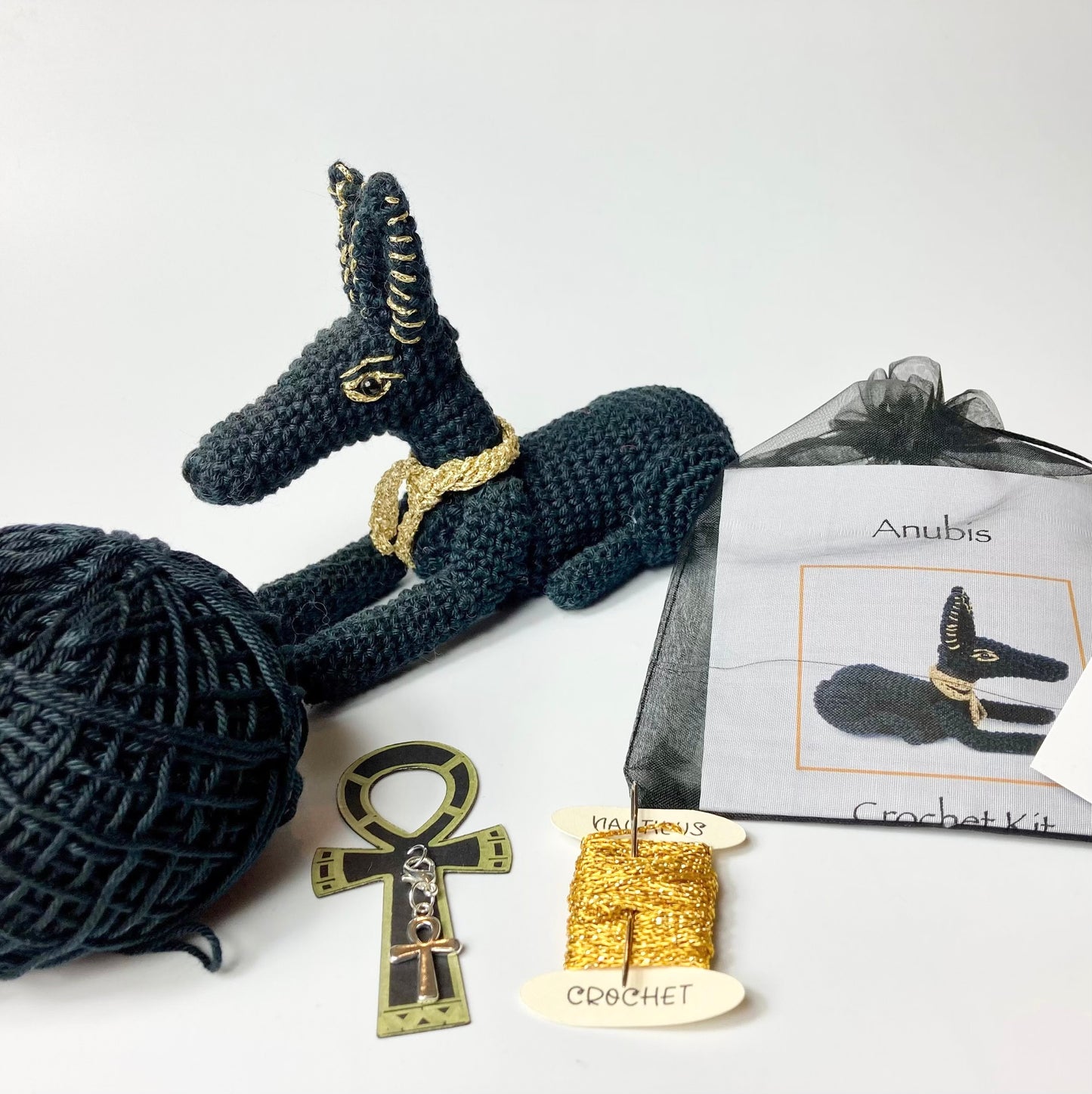 Anubis Crochet Kit. Complete Kit with Luxury British Yarn & a silver-plated Ankh Stitch-Marker. Designed for The British Museum.