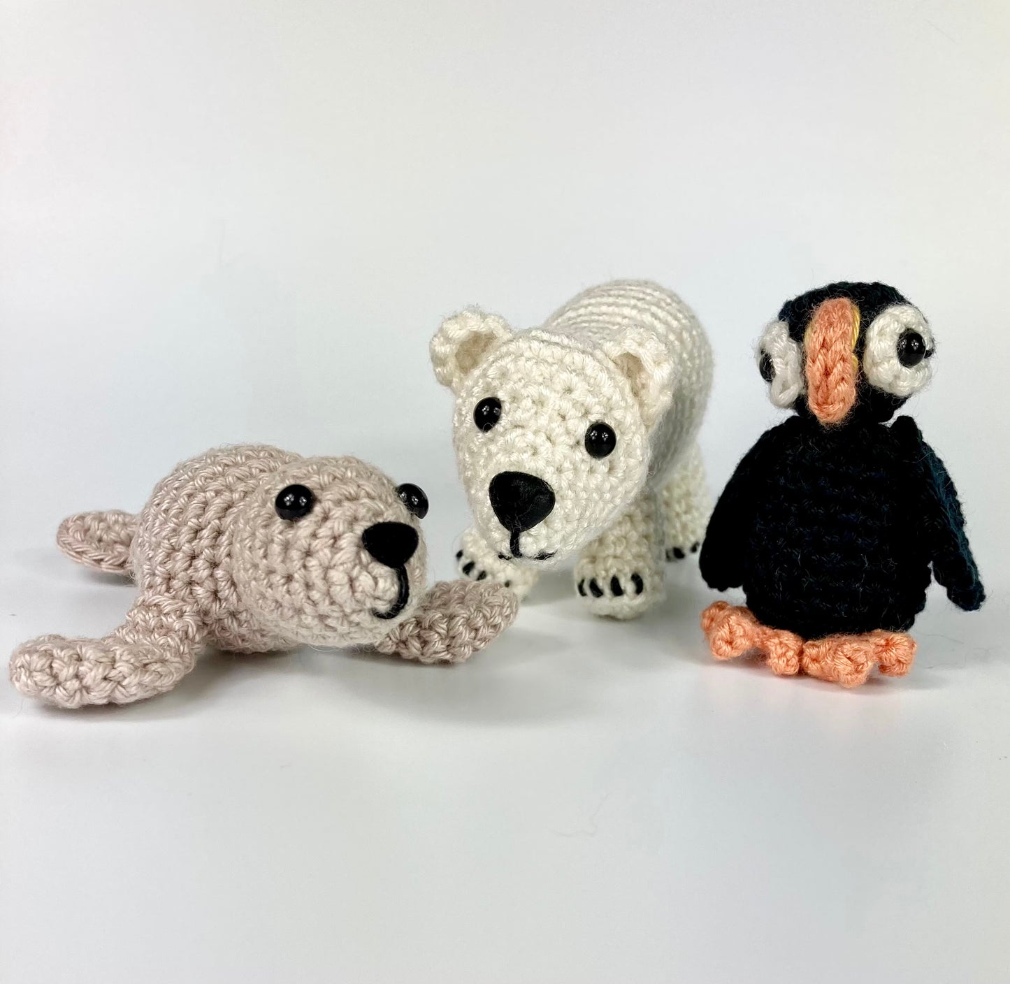 Polar Bear Cub Kit. A full kit with luxury yarns and fittings plus a silver fish stitch marker.