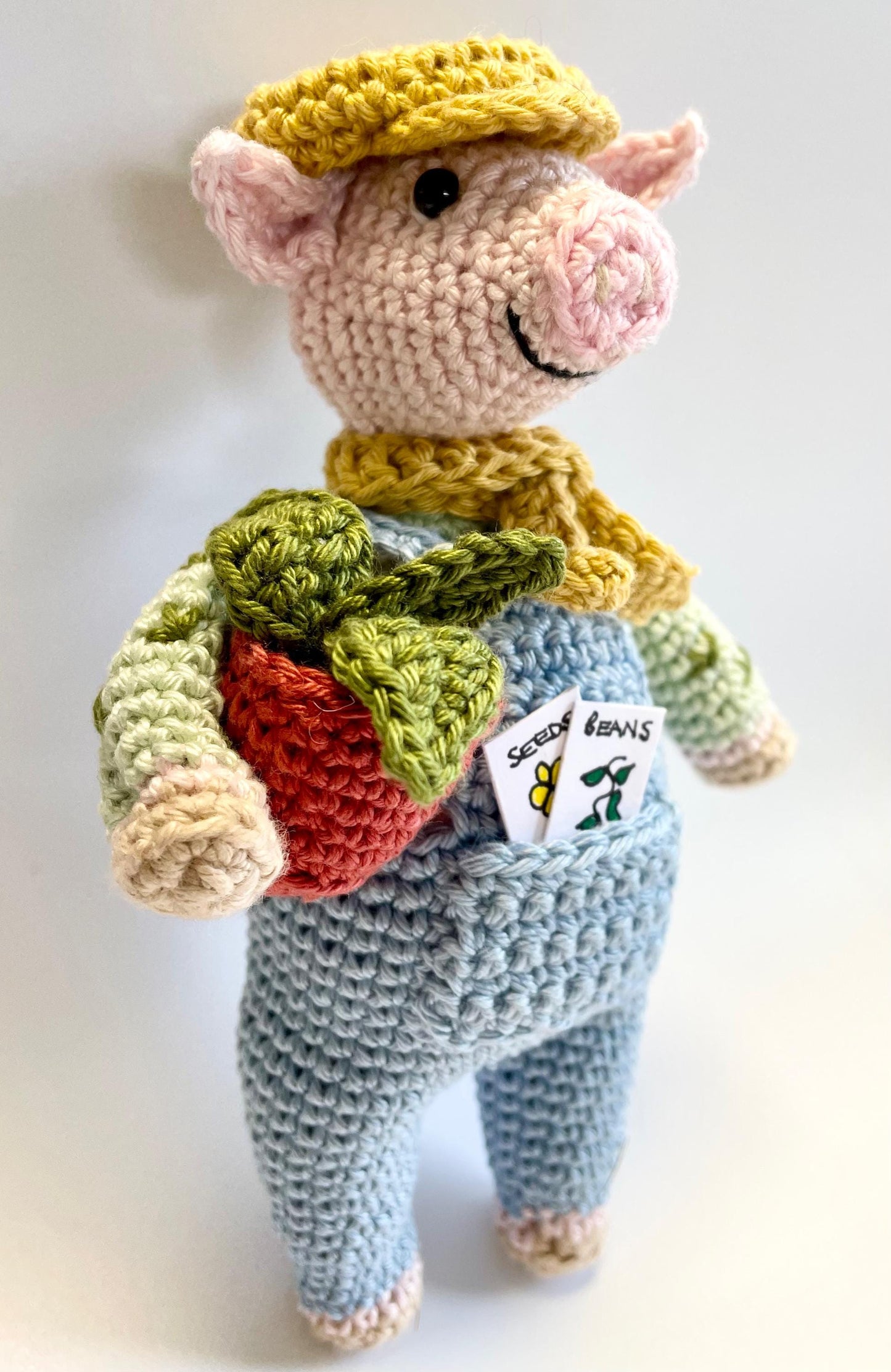 Ebb The Gardener! Pig Amigurumi Crochet Kit featuring Ebb, A laid-back, dungaree clad pig with a passion for Plants!