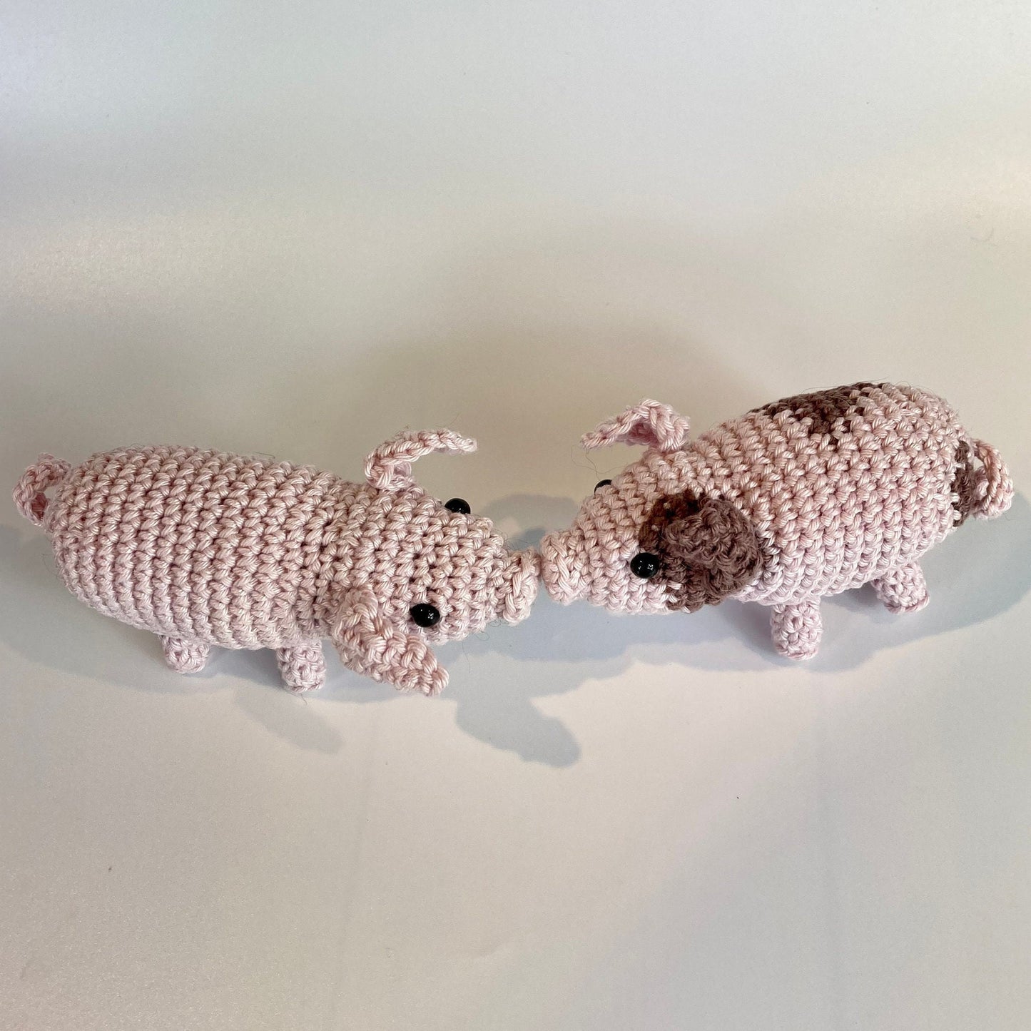 Piglets Crochet Kit. A complete kit for you to crochet a pair of the cutest piglets in luxury Natural British yarn. Mini pig stitch marker.
