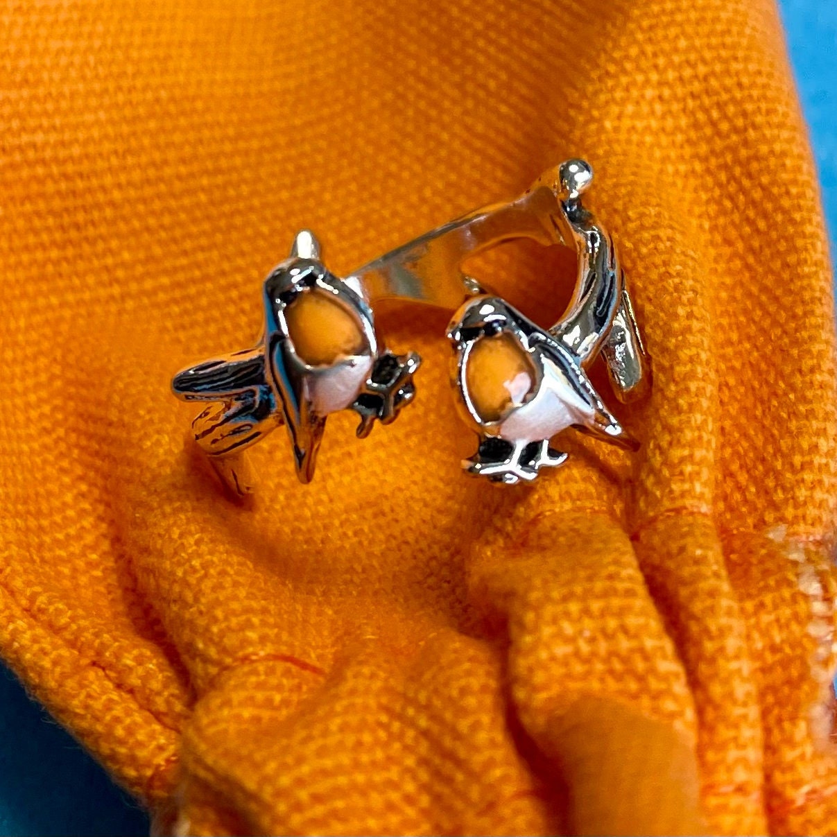 Robin Crochet Ring. This adorable ring features 2 robins perched on a gnarled branch. Silver plated & Size Adjustable. For Crochet Tension.