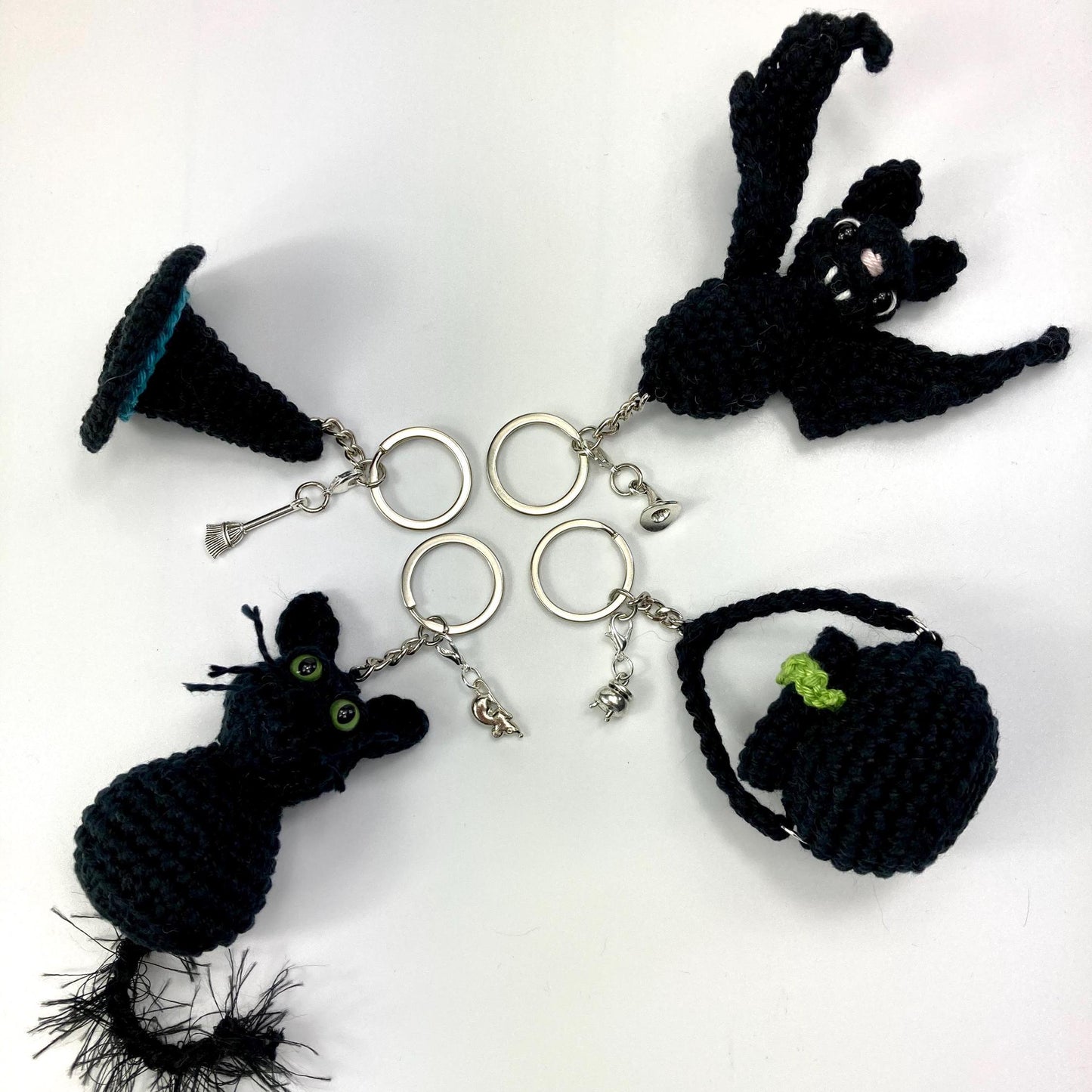 Witch’s Cauldron Keyring Crochet Kit. Including luxury yarns & a silver plated stitch marker/ keyring charm in a black velvet bag.
