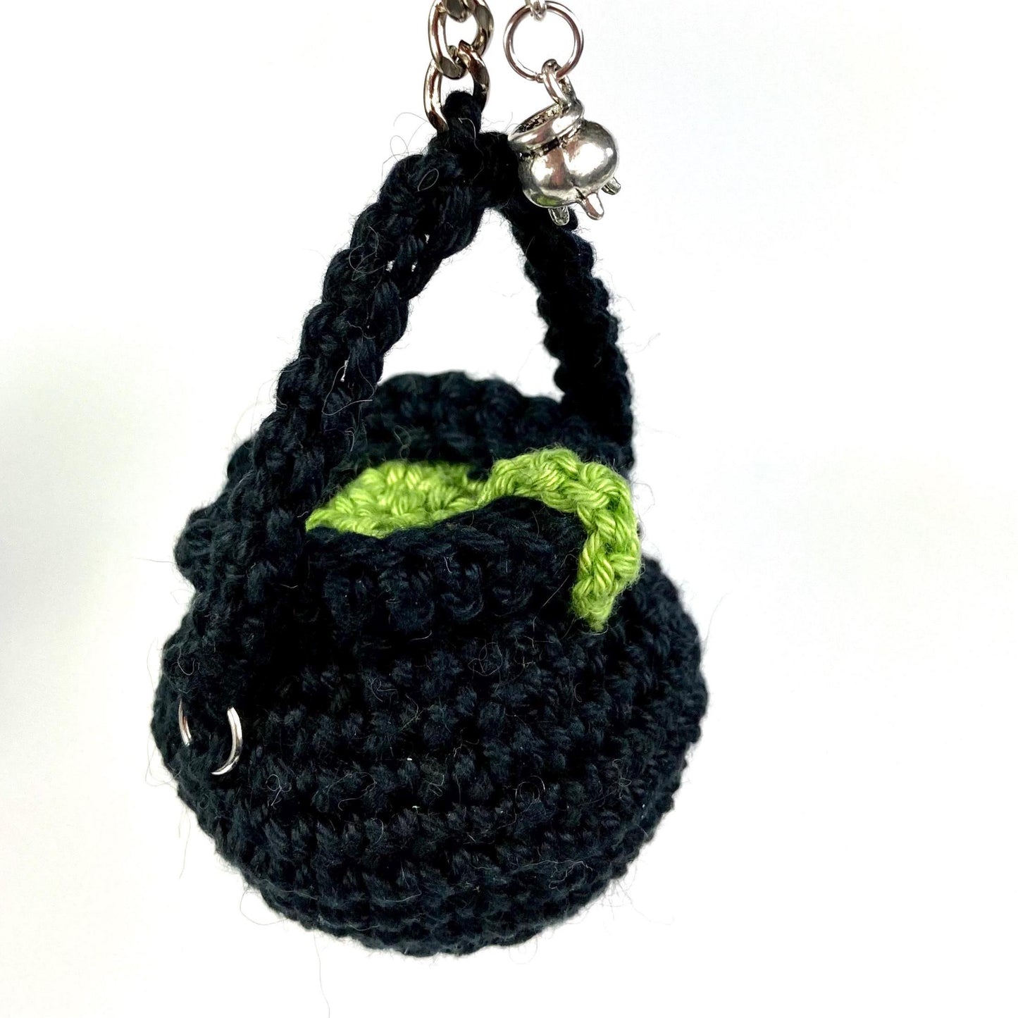 Witch’s Cauldron Keyring Crochet Kit. Including luxury yarns & a silver plated stitch marker/ keyring charm in a black velvet bag.