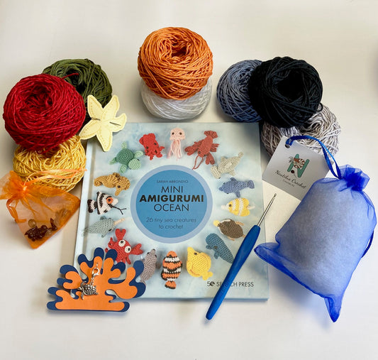 Crocheted Ocean Kit. Book, luxury yarn, crochet hook, turtle stitch marker & accessories. Make the cutest sea creature buddies!