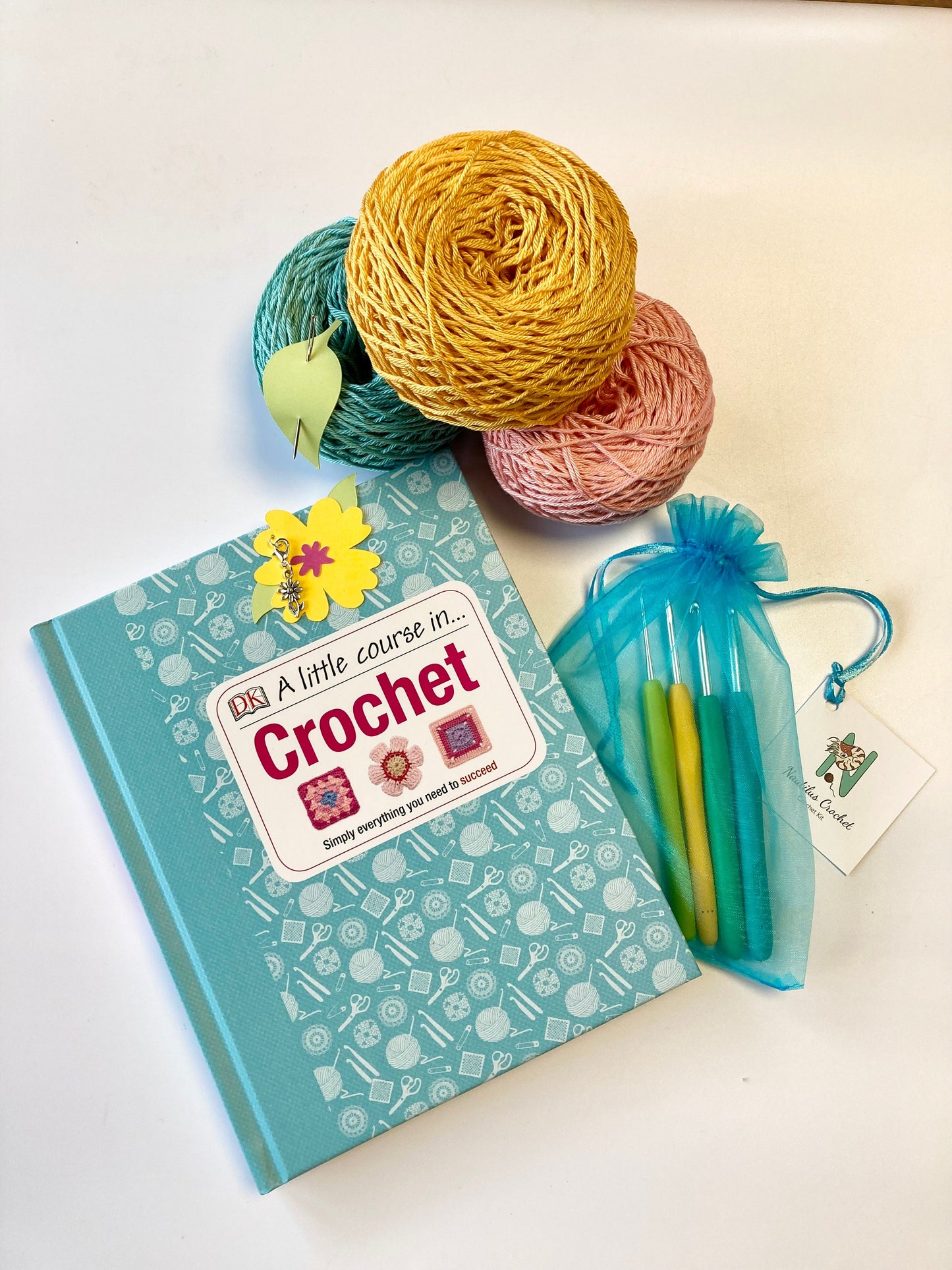 Spring Crochet Course Kit. A lovely kit with coloured yarns in 100% cotton, set of crochet hooks & cute accessories. Perfect for beginners.