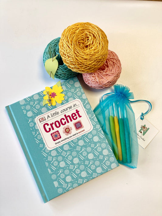 Spring Crochet Course Kit. A lovely kit with coloured yarns in 100% cotton, set of crochet hooks & cute accessories. Perfect for beginners.